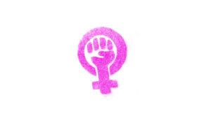 Símbolo feminista, hecho de brillantina púrpura.